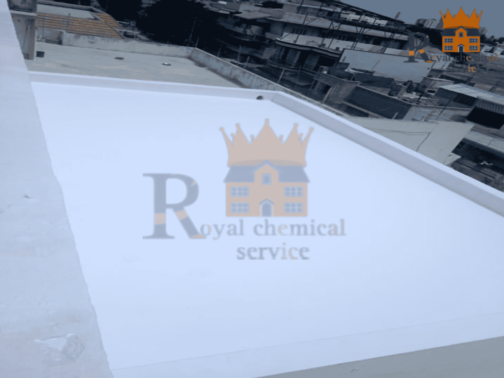 Man applying reflective coating to reduce roof temperature