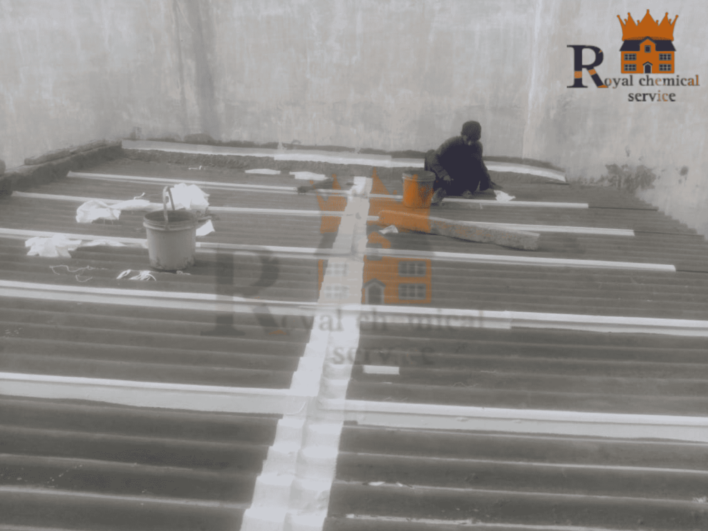 Waterproofing technician sealing rooftop cracks
